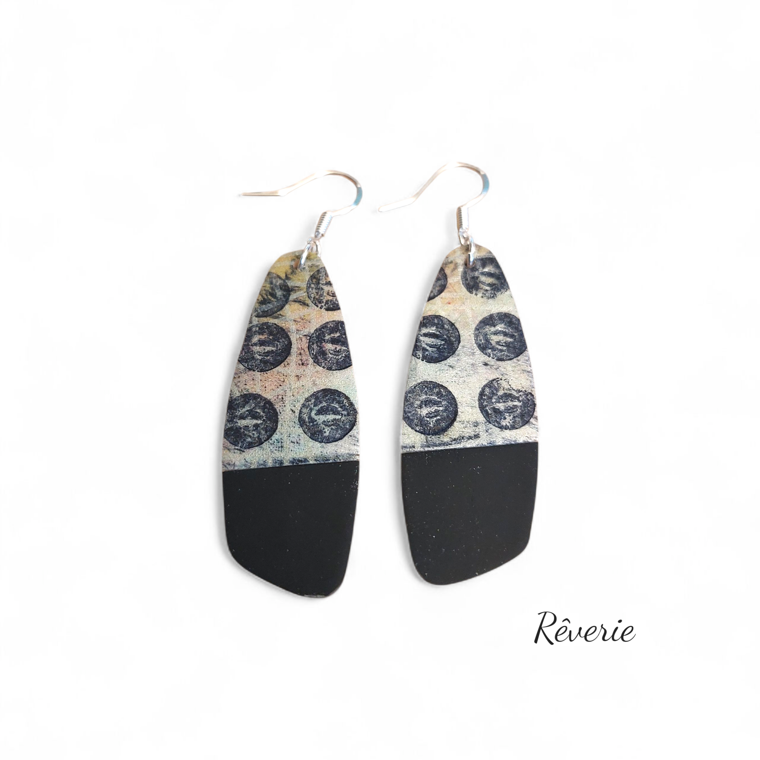 Sleek, bold, and graphic. These matte black and patterned polymer clay earrings strike the balance between edgy and elegant.