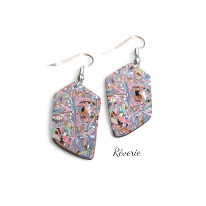 Color chaos, controlled. These angular polymer clay earrings are a kaleidoscope of marbled pastel and neon tones, finished in a striking geometric shape.