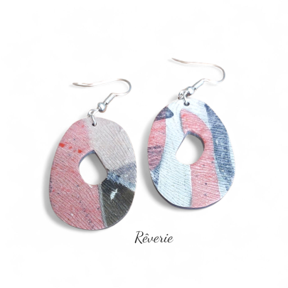 Organic shape, painterly texture. These abstract blush and navy polymer clay earrings bring artful calm with every wear.